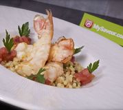 Langoustines rôties et chutney de tomates au jambon fumé